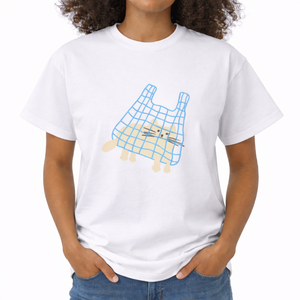 Child wearing a white t-shirt with a graphic design of a blue bag over a dog's head on a white background. The center chest features a minimalist, hand-drawn graphic of a light beige cat sitting inside a blue, gridded shopping bag. The cat's paws and tail are poking out of the bottom of the bag, and its face is drawn with simple black dot eyes and straight whiskers.