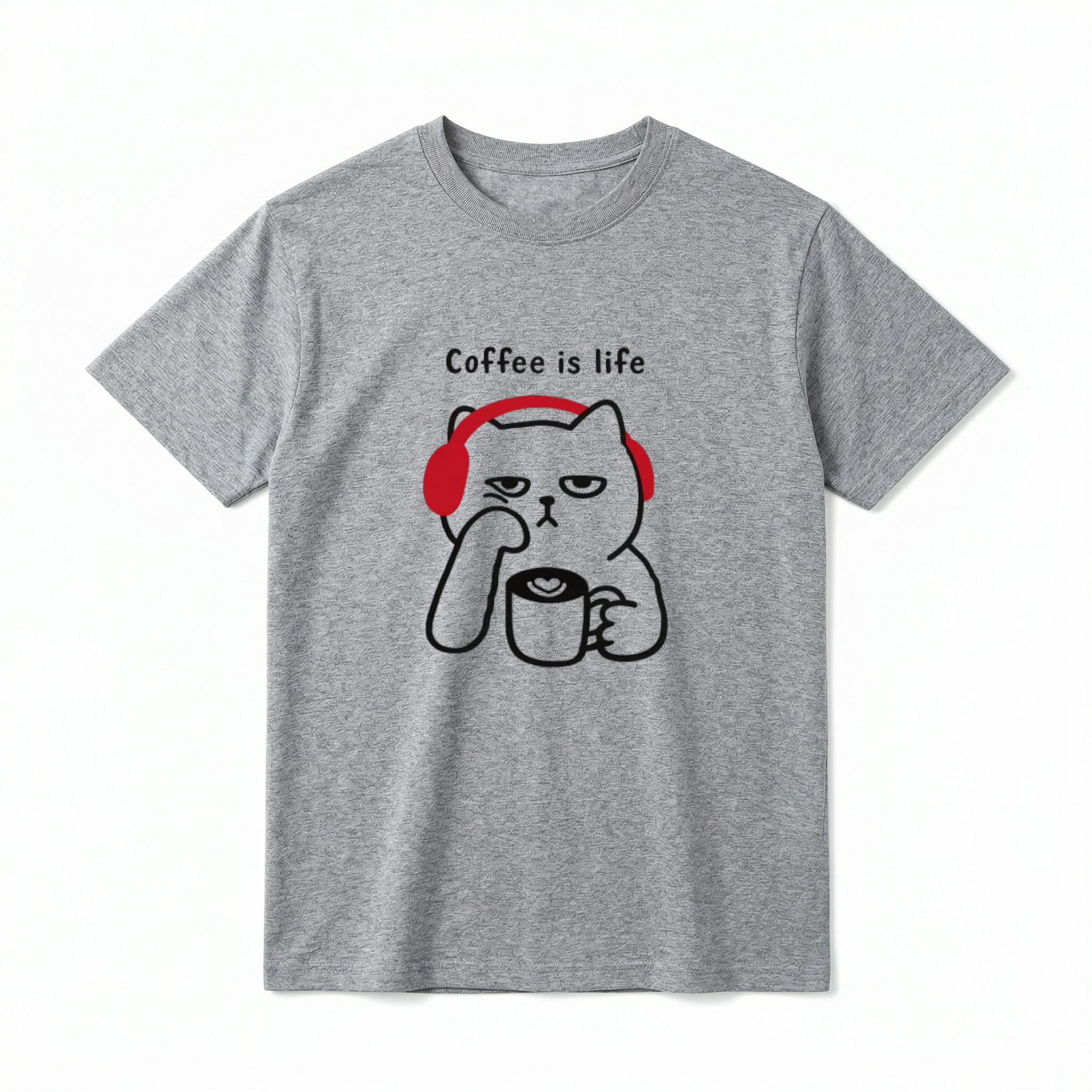 A flat lay of a short-sleeve t-shirt. The center chest features a black line-art graphic of a grumpy-looking cat wearing bright red headphones. The cat is resting its chin on one paw and holding a coffee mug with a latte art heart in the other. Above the cat, the text reads "Coffee is life" in a simple, playful black font.