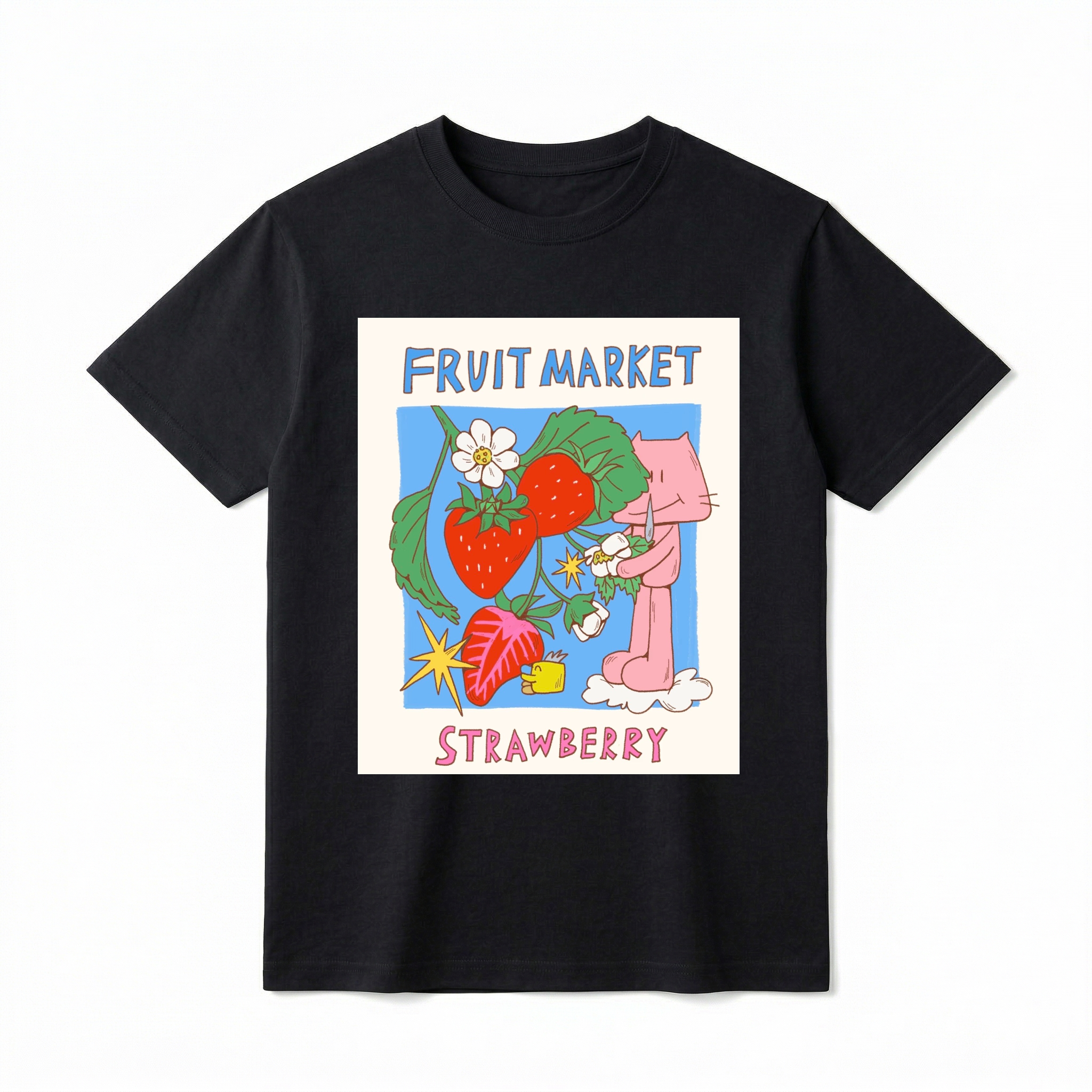 A flat lay of a short-sleeve t-shirt. The center features a colorful graphic with the text "FRUIT MARKET" at the top in blue, hand-drawn letters. Below it is a light blue square containing illustrations of bright red strawberries on a leafy green vine with white blossoms, a sliced strawberry half, and a retro yellow starburst. On the right side, a cute pink cartoon cat stands on a small white cloud, holding a little flower. The word "STRAWBERRY" is printed at the bottom in bold pink text.
