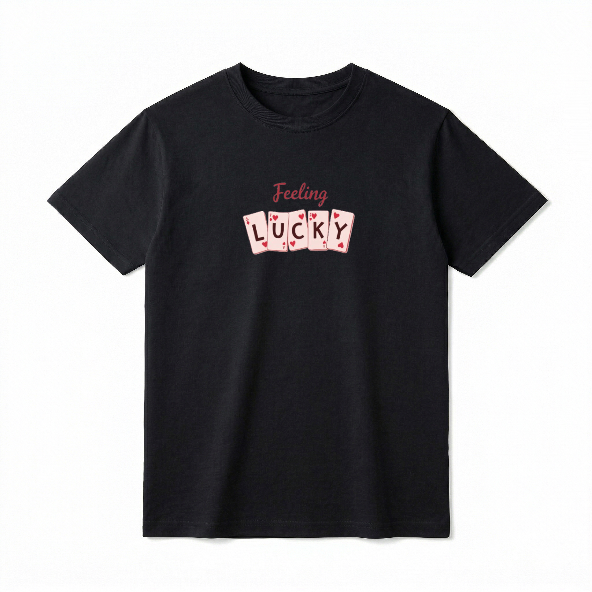 A flat lay of a short-sleeve t-shirt. On the front chest, script text reads "Feeling" above a row of five slightly overlapping playing cards. One letter is centered on each card, spelling out the word "LUCKY".