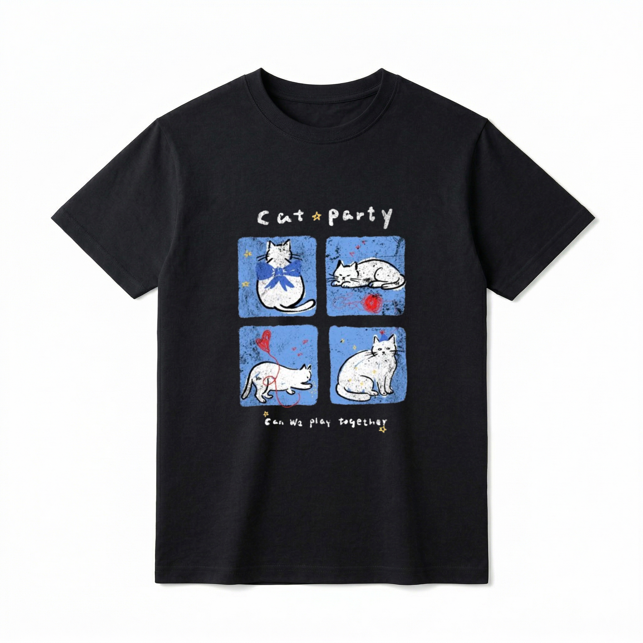 A flat lay of a short-sleeve t-shirt. The center graphic features the text "Cat party" above four blue squares showing white cartoon cats wearing bows, sleeping by red yarn, playing with a balloon, and wearing party hats. Below the panels is the text "Can We play together" surrounded by tiny yellow stars.
