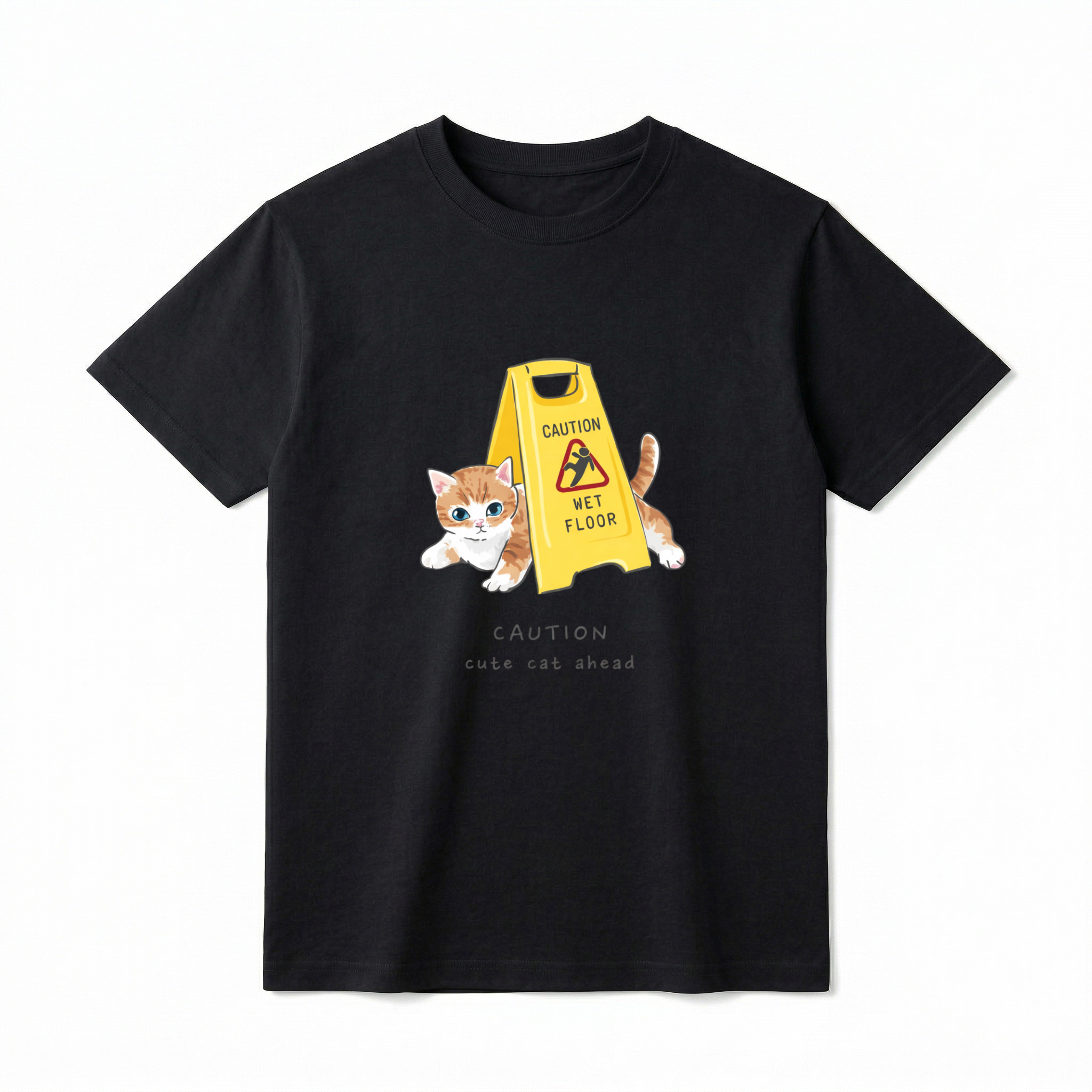 A flat lay of a short-sleeve t-shirt. The center chest features a graphic of a small orange and white kitten peeking out from behind a bright yellow "CAUTION WET FLOOR" A-frame sign. Below the illustration, the text reads "CAUTION cute cat ahead" in a playful, casual font.