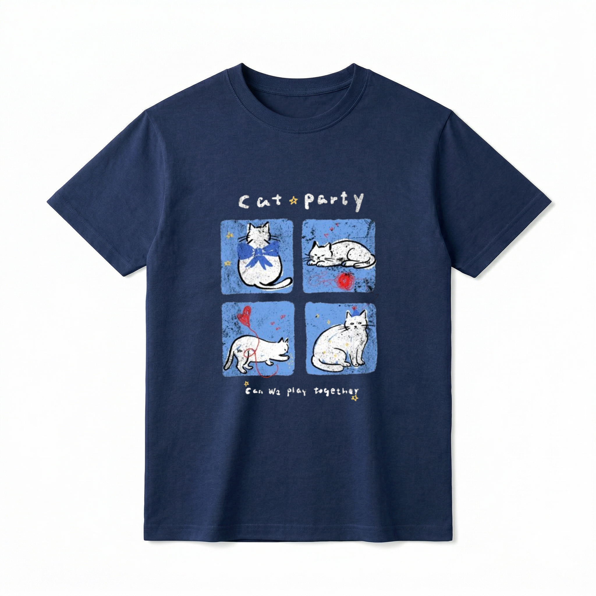 A flat lay of a short-sleeve t-shirt. The center graphic features the text "Cat party" above four blue squares showing white cartoon cats wearing bows, sleeping by red yarn, playing with a balloon, and wearing party hats. Below the panels is the text "Can We play together" surrounded by tiny yellow stars.