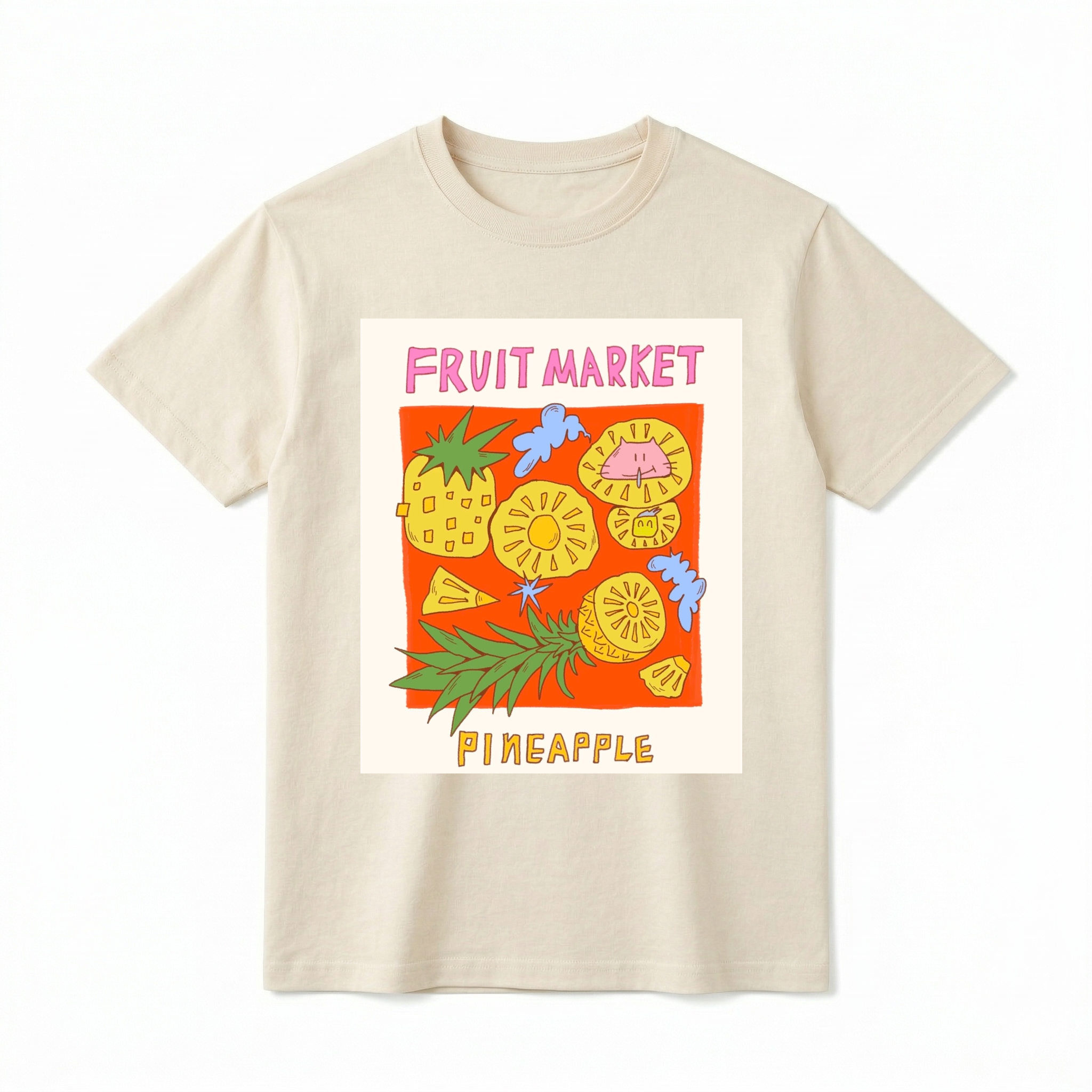 A detailed flat lay of a short-sleeve t-shirt. The center features a prominent graphic of a colorful, kitschy "Fruit Market" panel. The art includes a whole pineapple, various slices and wedges of pineapple, and abstract cloud shapes, with the text "FRUIT MARKET" at the top in pink font and "PINEAPPLE" at the bottom in yellow font.