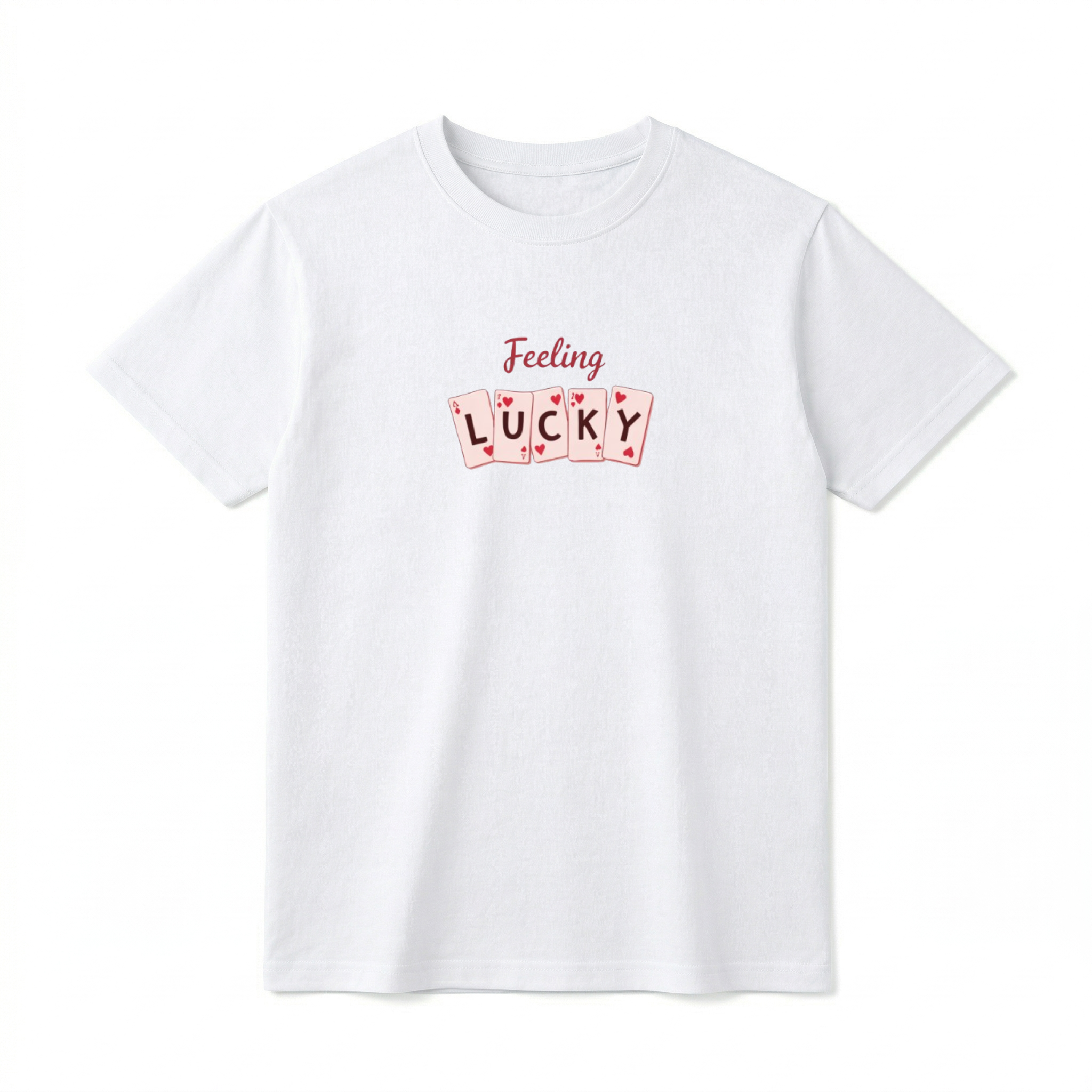 A flat lay of a short-sleeve t-shirt. On the front chest, script text reads "Feeling" above a row of five slightly overlapping playing cards. One letter is centered on each card, spelling out the word "LUCKY".