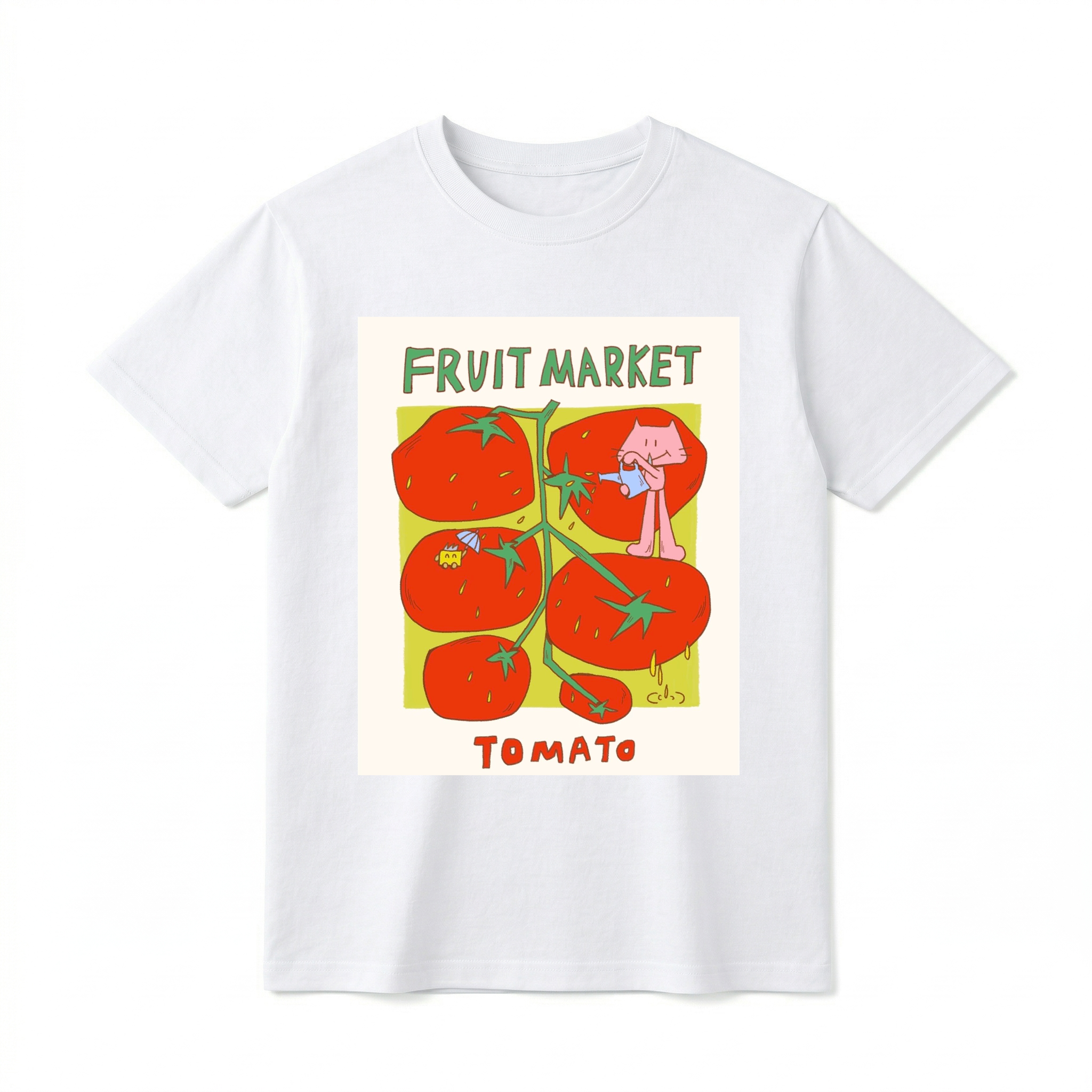 A flat lay of a short-sleeve t-shirt. The center features a colorful graphic with the text "FRUIT MARKET" at the top in green, hand-drawn letters. Below it is a light green square containing illustrations of a vine with five large, bright red tomatoes. A cute pink cartoon cat stands on one of the tomatoes, pouring water from a small blue watering can. Another tomato features a tiny yellow creature holding a blue umbrella. The word "TOMATO" is printed at the bottom in bold red text.