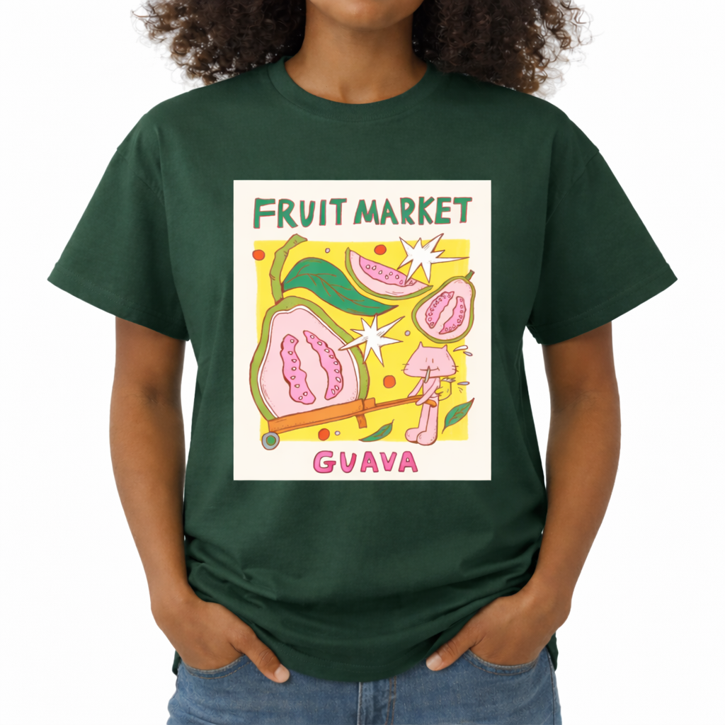Person wearing a green t-shirt with a colorful guava graphic and text. The center features a colorful graphic with the text "FRUIT MARKET" at the top in green, hand-drawn letters. Below it is a yellow square containing illustrations of pink guavas, green leaves, and retro white starbursts. In the foreground, a cute pink cartoon cat is pushing a large half-slice of guava in an orange wheelbarrow. The word "GUAVA" is printed at the bottom in bold pink text.