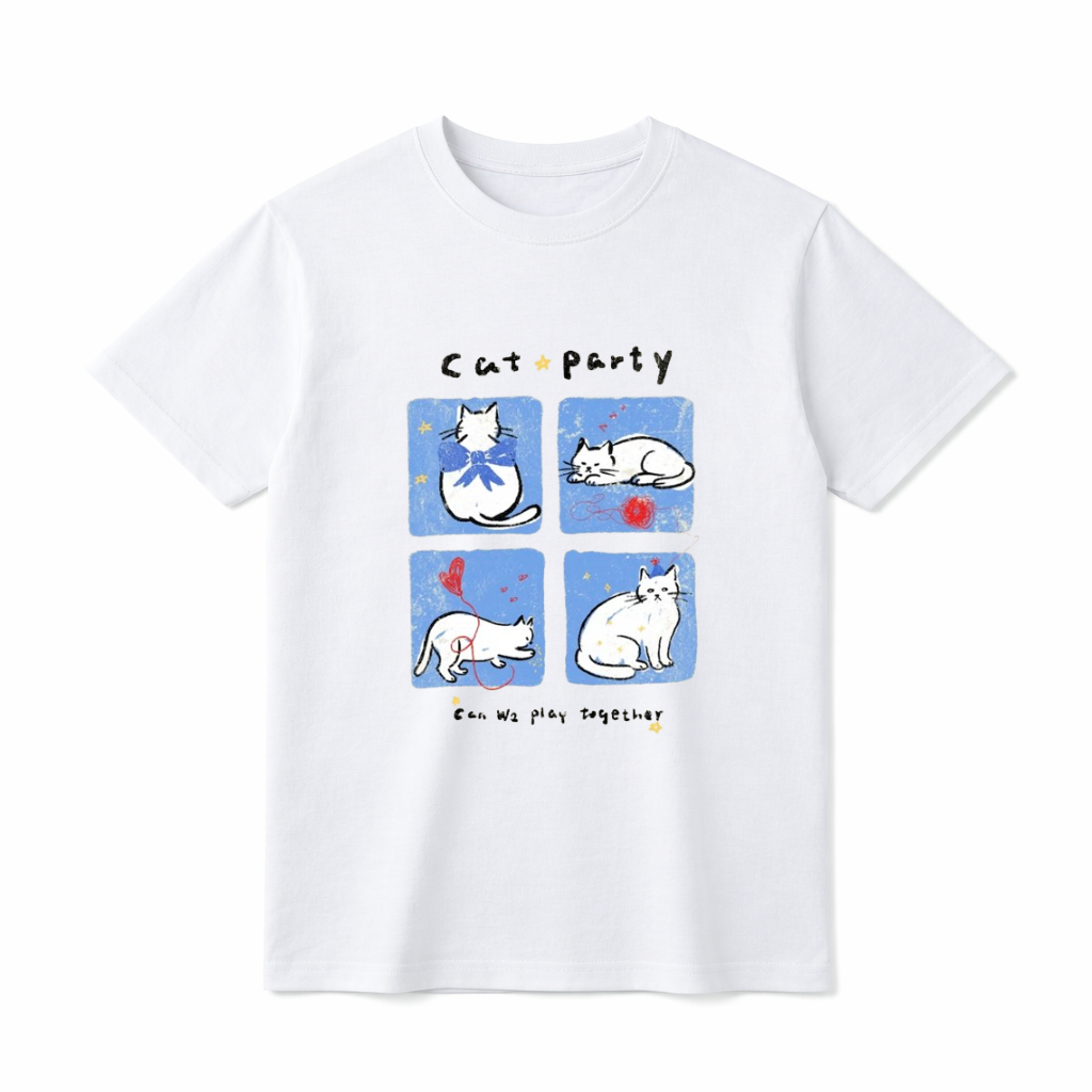 A flat lay of a short-sleeve t-shirt. The center graphic features the text "Cat party" above four blue squares showing white cartoon cats wearing bows, sleeping by red yarn, playing with a balloon, and wearing party hats. Below the panels is the text "Can We play together" surrounded by tiny yellow stars.
